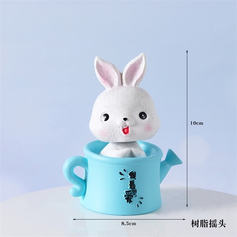 Thỏ ngồi bình tưới màu XANH