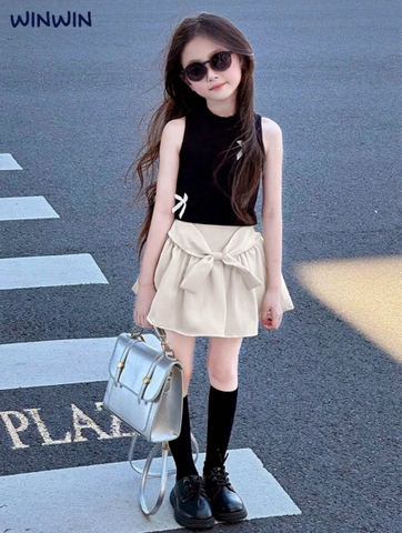 Bộ WinWin 9-14Y Nexxi áo thun sát nách croptop 2 màu hồng, đen đính nơ chân váy kate xoè