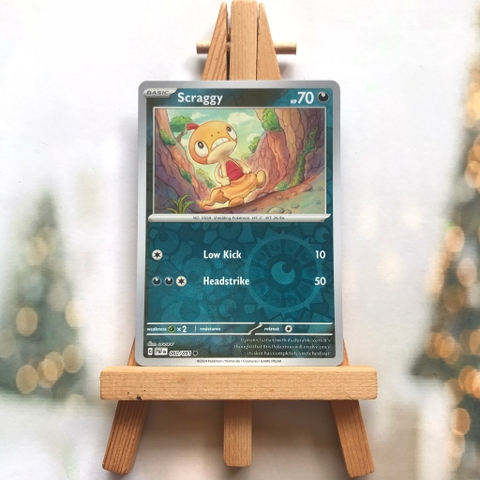 Thẻ hình Pokemon Scraggy 060/091 - Lá bài lẻ Paldean Fates Common Reverse Holo tiếng Anh chính hãng
