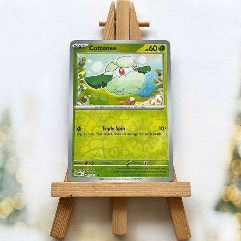 Thẻ hình Pokemon Cottonee 007/131 - Lá bài lẻ Prismatic Evolutions Common Reverse Holo tiếng Anh chính hãng