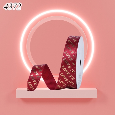 Ruybang lụa chữ love đỏ đô khổ2.5cm,45m.