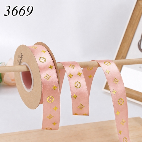 Ruybang hoạ tiết vàng đồng 2.5cm 50m