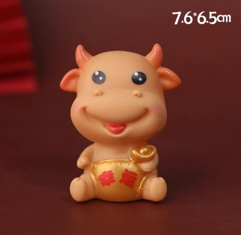 Trâu cầm thỏi vàng.