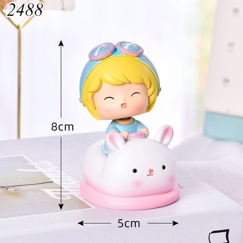 Tuong - bé gái cưỡi ngồi xe thỏ