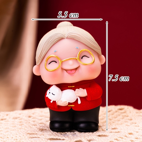 Tượng - bà đỏ bế mèo đỏ nhựa dẻo