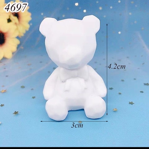 Tượng gấu đeo nơ trắng nhựa mềm