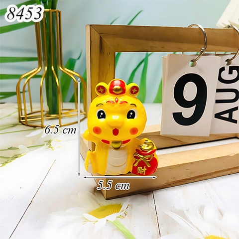Rắn vàng đội mũ cầm hũ tiền TT