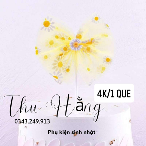 QC-Que cắm nơ vải màu vàng