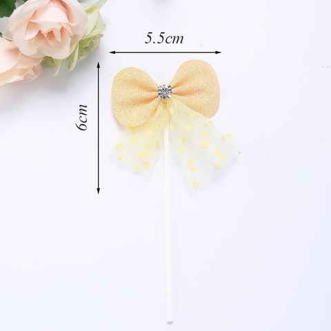 QC-que cắm nơ vải kim tuyến vàng đính kim cương