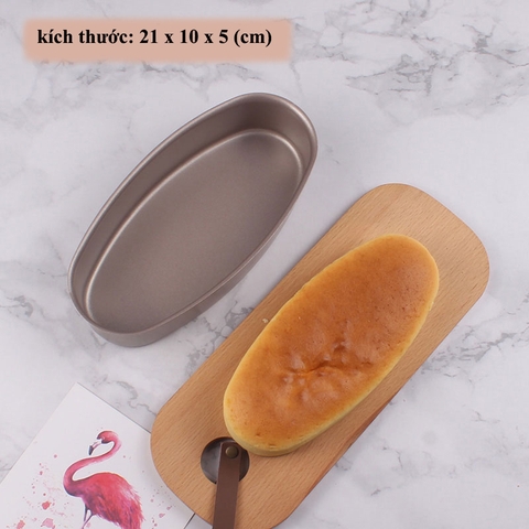 🎂 KHUÔN BÁNH CHẤT LƯỢNG CAO - CHỐNG DÍNH - DẪN NHIỆT TỐT 🎂 📍 Có mặt tại Dụng Cụ Nghề Hoàng Long - Biên Hòa  ✅ Khuôn Oval Nhôm Đúc Chống Dính Màu Vàng Đồng Kích thước: 21 x 10 x 5 cm | Trọng lượng: 140g  Chất liệu nhôm cao cấp, dày dặn, dẫn nhiệt tốt cho bánh chín đều, vàng đẹp  Lòng khuôn phủ chống dính cao cấp màu