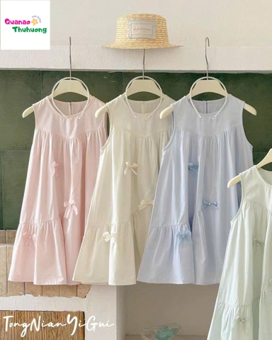 Đầm xanh đính nơ ngọc trai
