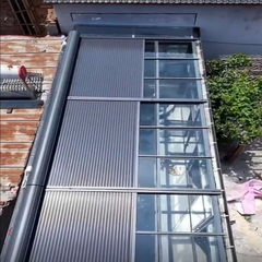 Mái nhôm cuốn chống nắng tự động trên mái kính