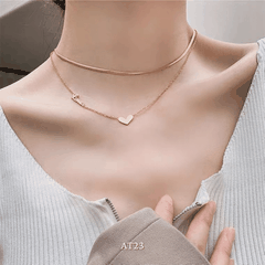 Dây chuyền titan không đen gỉ sợi đôi mặt tim mạ vàng nữ tính thanh lịch AT23