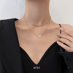 Dây chuyền titan không đen gỉ sợi đôi mặt tim mạ vàng nữ tính thanh lịch AT23