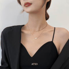 Dây chuyền titan không đen gỉ sợi đôi mặt tim mạ vàng nữ tính thanh lịch AT23