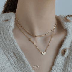 Dây chuyền titan không đen gỉ sợi đôi mặt tim mạ vàng nữ tính thanh lịch AT23