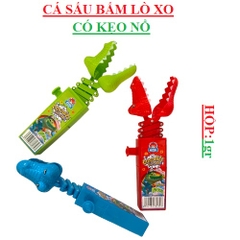 Đồ chơi bấm lò xo cá sấu có chứa kẹo nổ hộp 1gr