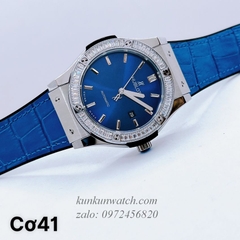 Đồng Hồ Nam Hublot Automatic Viền Đá Vuông Dây Da Vân Silicone Xanh Silver 42mm