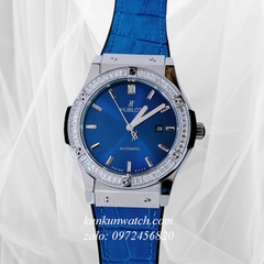 Đồng Hồ Nam Hublot Automatic Viền Đá Vuông Dây Da Vân Silicone Xanh Silver 42mm