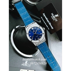 Đồng Hồ Nam Hublot Automatic Viền Đá Vuông Full Vỏ Dây Da Vân Silicone Xanh Silver 42mm