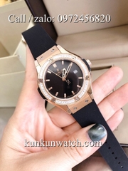 Đồng Hồ Nữ Hublot HLNSV014 - Dây Đen Mặt Đen Vỏ Bạc - 34mm