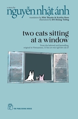 Two Cats Sitting At A Window