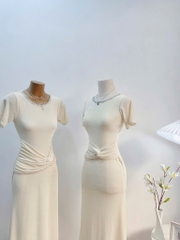 Đầm body kem xoắn eo