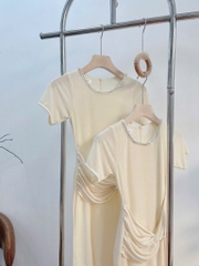 Đầm body kem xoắn eo