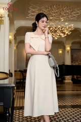 46086W66 - Đầm be kem xòe cổ đính nơ- carolan