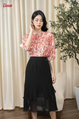 34026B63 - Chân váy tơ đen, nhún tầng xòe lệch.