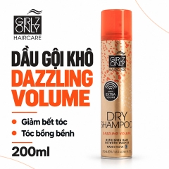 Một chai dầu gội khô Girlz Only Dazzling Volume 200ml, thân màu đồng và nắp cam.