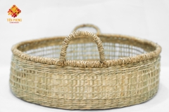 Seagrass storage basket with hand