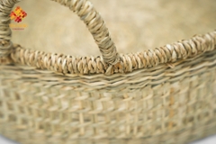 Seagrass storage basket with hand