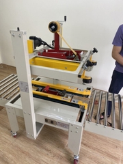 Máy dán băng dính thùng FXJ 6050
