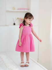 Váy hồng đậm cánh tiên 2T nơ lưng