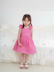 Váy hồng đậm cánh tiên 2T nơ lưng