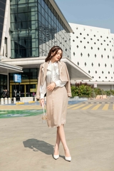 Chân váy dài bổ mảnh rút rua gấu