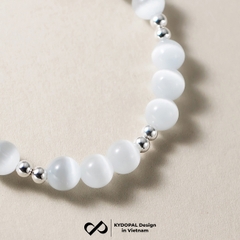Lắc tay KYDOPAL đá mắt mèo 6mm cá tính thạch anh dâu hồng mix charm chuông đôi - PAL9C8L20