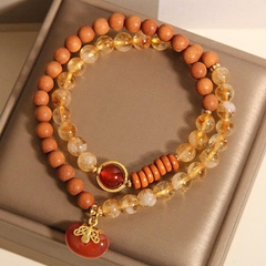 Vòng tay gỗ đàn hương pha lê tháp vàng tự nhiên TS229250