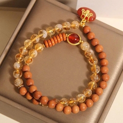 Vòng tay gỗ đàn hương pha lê tháp vàng tự nhiên TS229250