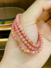 Đá đào hoa cuốn 3 mix charm di lạc bọc bạc phủ v24k