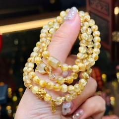 chuỗi thạch anh tóc vàng 5.5mm đồng trục mix charm v18k