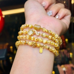 chuỗi thạch anh tóc vàng 5.5mm đồng trục mix charm v18k