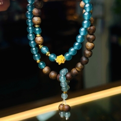 chuỗi lam băng ngọc đậm 5.8mm mix trầm chìm hải nam 6.5mm charm v24k