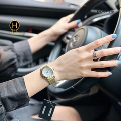 Đồng Hồ Nữ Citizen Quartz Eco-Drive EM0794-54D Dây Thép Vàng Mặt Trắng Xà Cừ