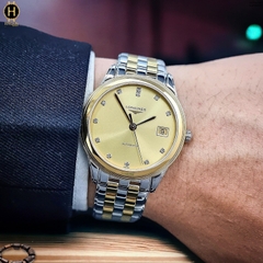 Đồng Hồ Nam Longines Automatic Flagship L4.774.3.37.7 (L47743377) Dây Thép Demi Vàng Mặt Vàng Sapphire.