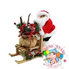 Ông già Santa đẩy xe gỗ