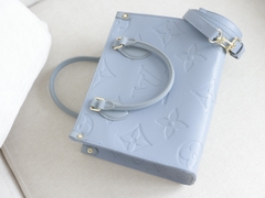 Túi L Onthego Da Bò Họa Tiết Dập Size 25cm Có 2 hộp