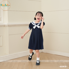 Váy bé gái xanh than đính nơ trắng A0410