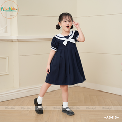 Váy bé gái xanh than đính nơ trắng A0410